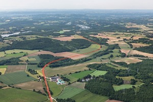 1 The endless steel cord belt is about 13 km long and does a twist and turn on the head and tail of the system to run parallel to the loaded belt on the return. Limestone residues remain on the returning belt rather than falling underneath