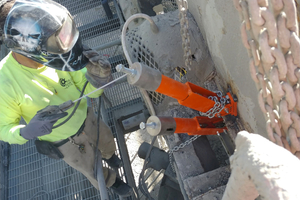 A technician makes the final tensioning adjustment this Cleanscrape™ blade will need for the life of the cleaner
